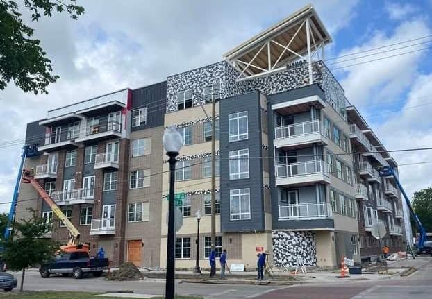 Apartment building with exterior tile accent panels