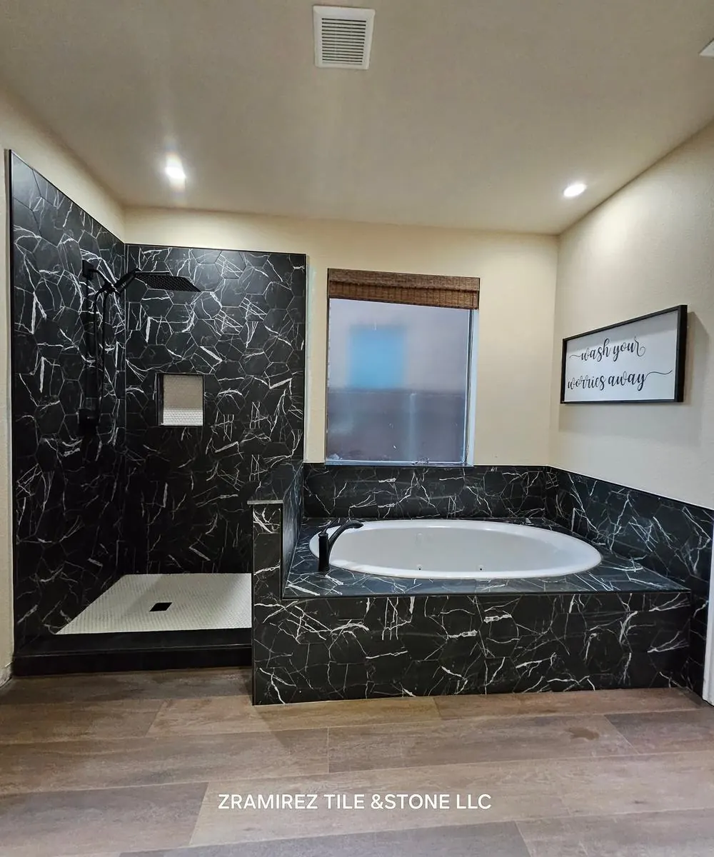 Black marble-look tub surround and walk-in shower