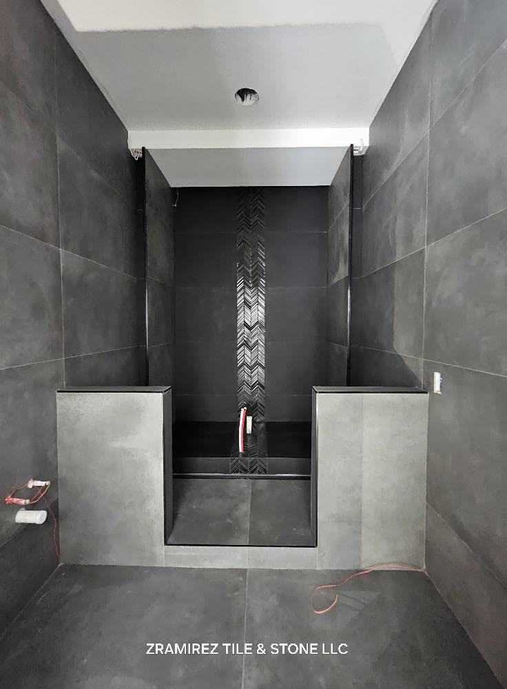 Charcoal porcelain shower with mosaic accent strip