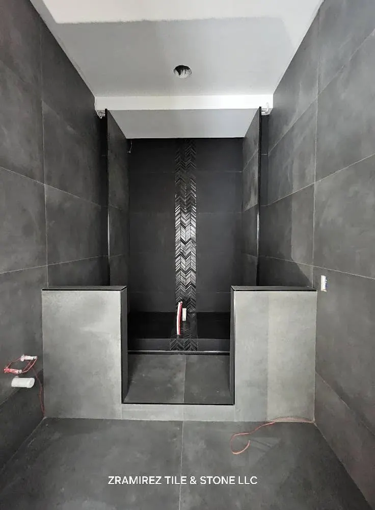 Charcoal porcelain shower with mosaic accent strip