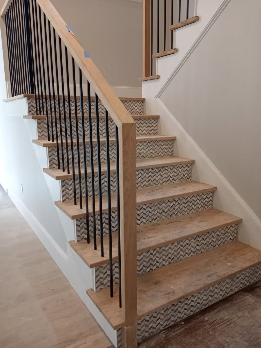 Chevron tile stair risers with wood treads