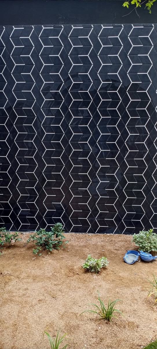 Navy geometric tile wall at street level