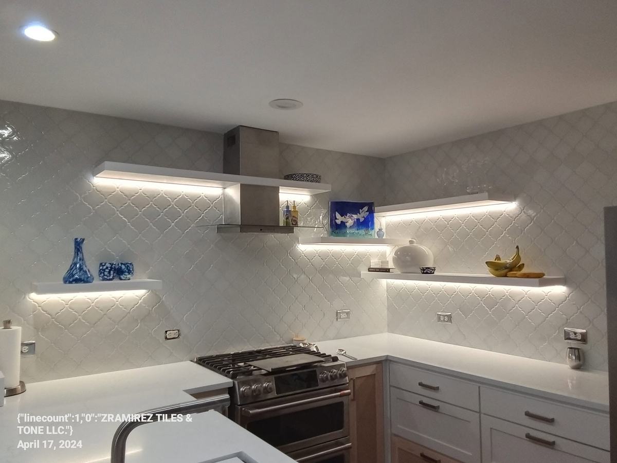 Kitchen backsplash with lit open shelving