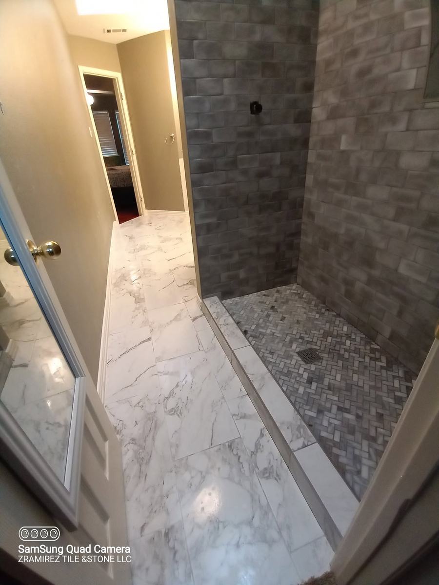Marble-look bathroom with walk-in shower