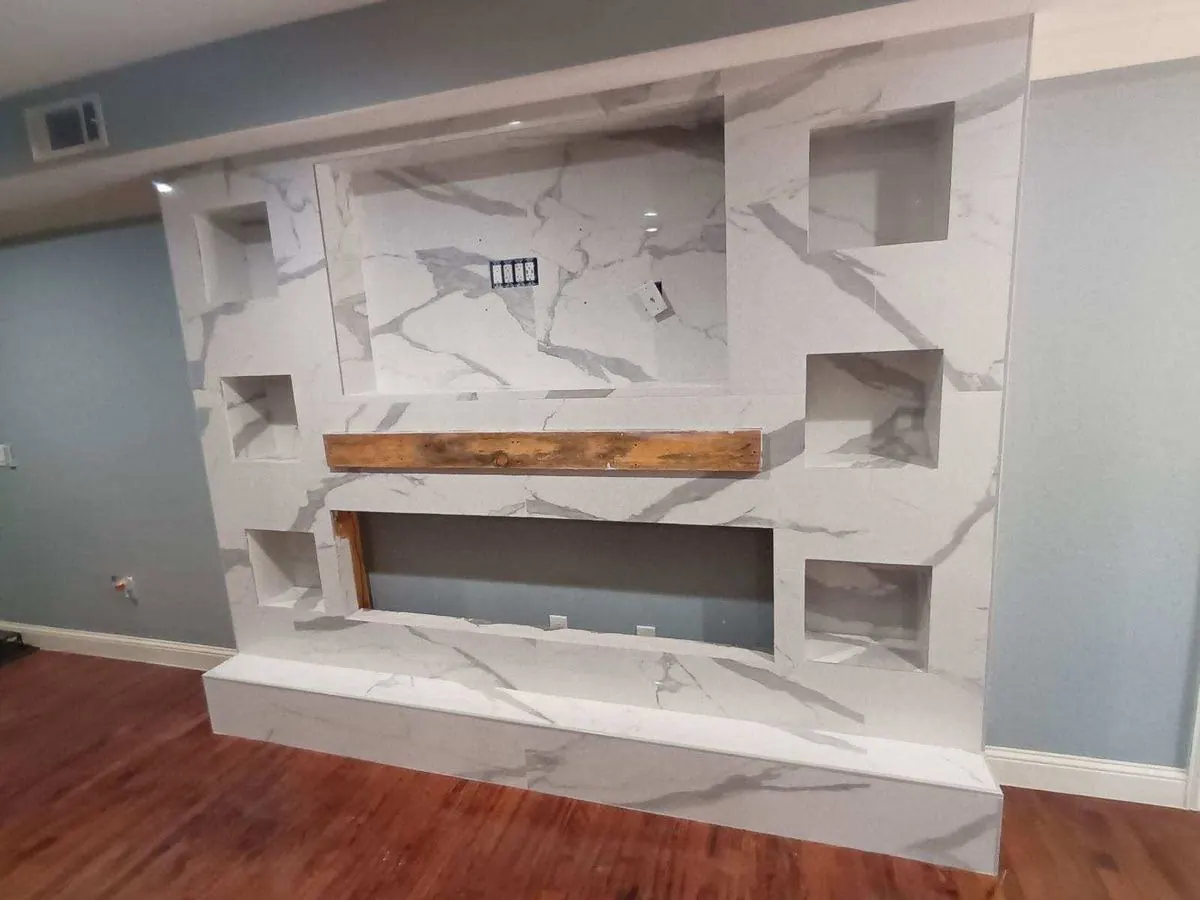 Marble-look fireplace wall with niches
