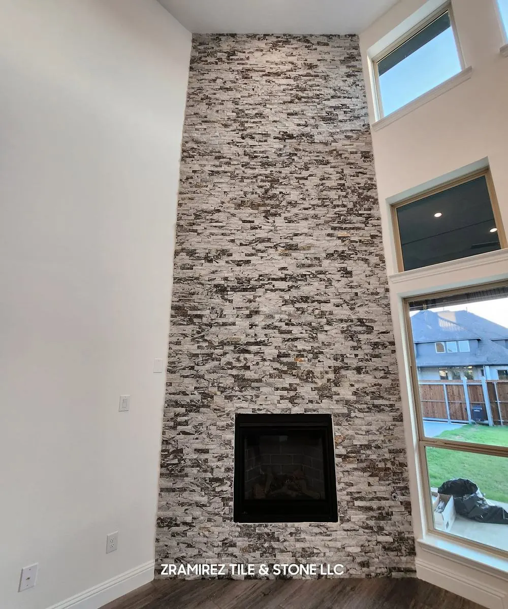 Floor-to-ceiling stacked-stone fireplace