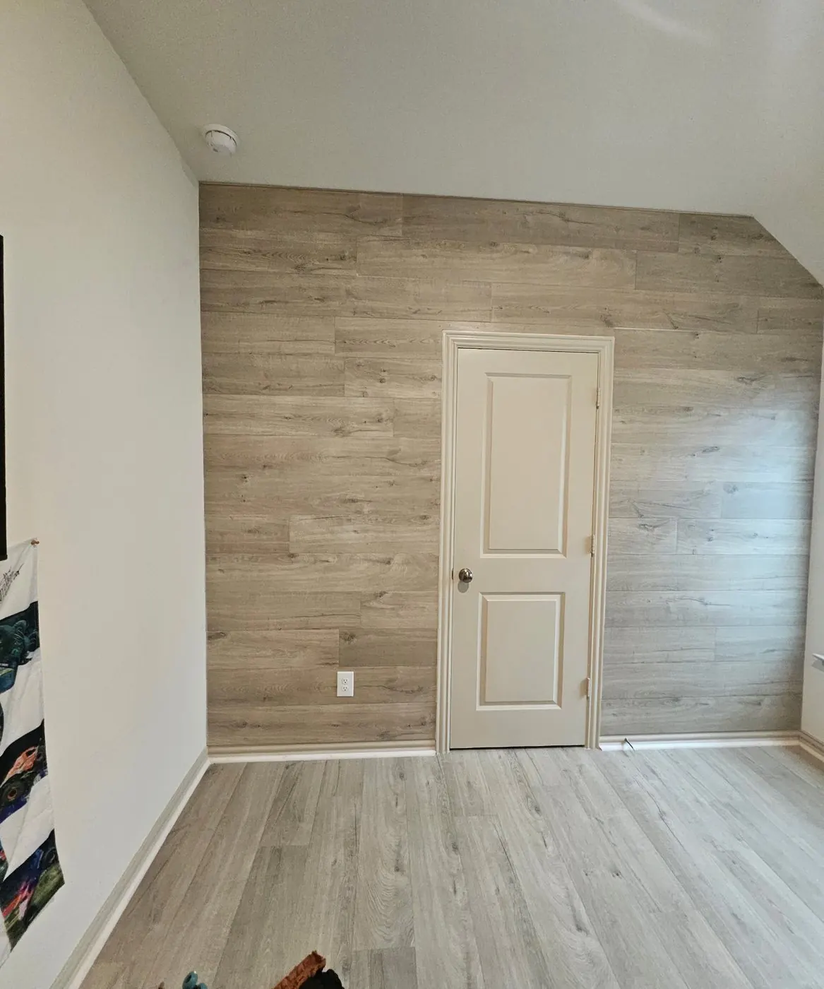Wood-look plank floor with a matching accent wall